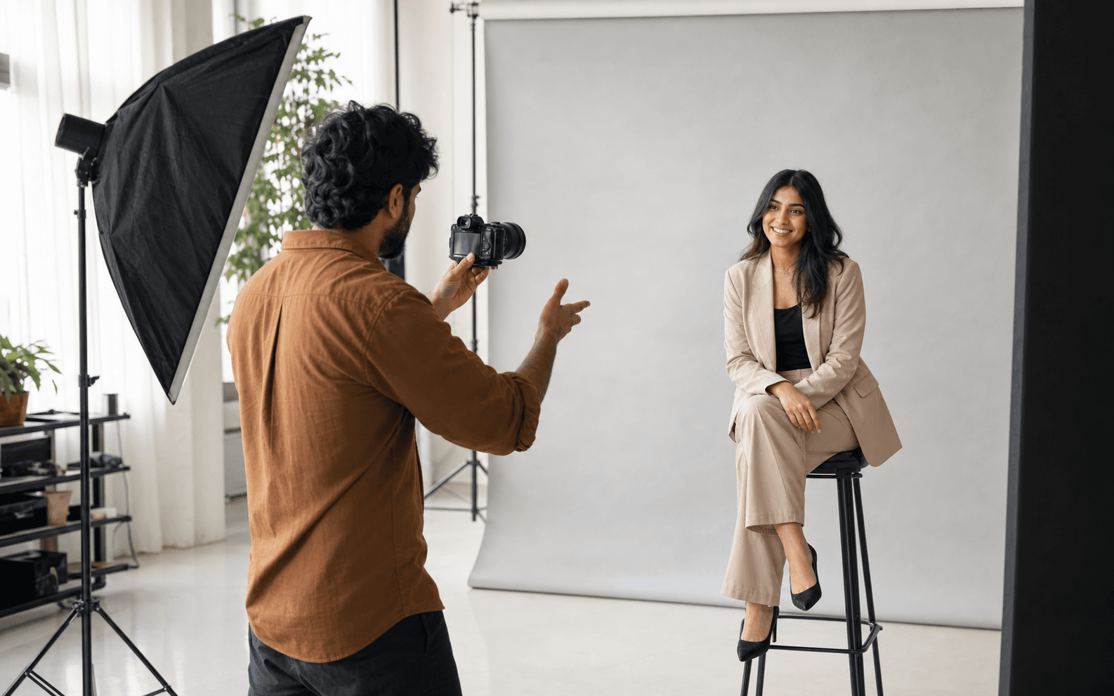 Photographer directing a client during a studio session